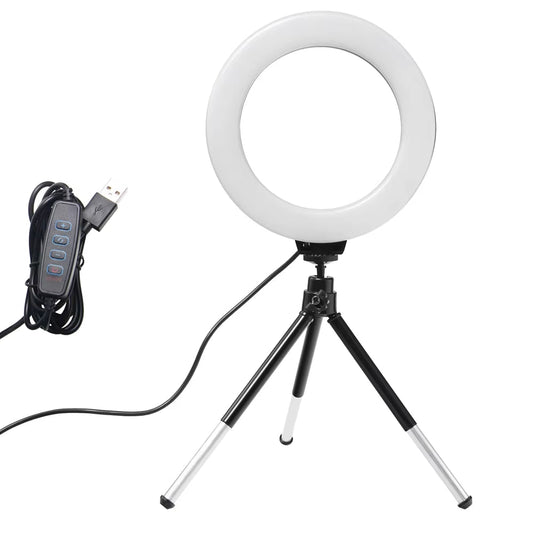 The 6 - inch mini LED desktop video ring light with a tripod stand and USB plug is a versatile lighting tool for live photo photography in a studio setting. - Dymand