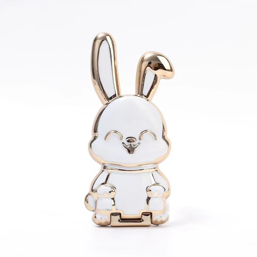 The finger ring phone holder is a compact and lightweight desktop accessory that features a cartoon rabbit design. - Dymand