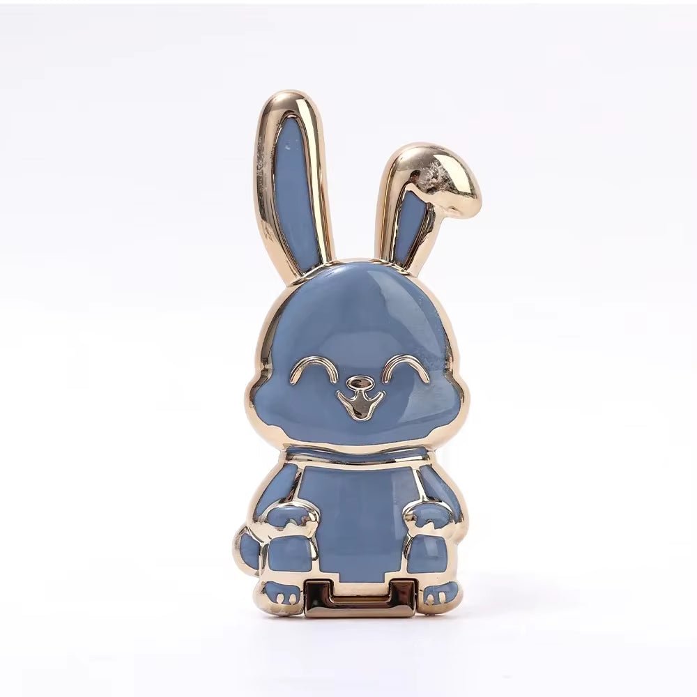 The finger ring phone holder is a compact and lightweight desktop accessory that features a cartoon rabbit design. - Dymand