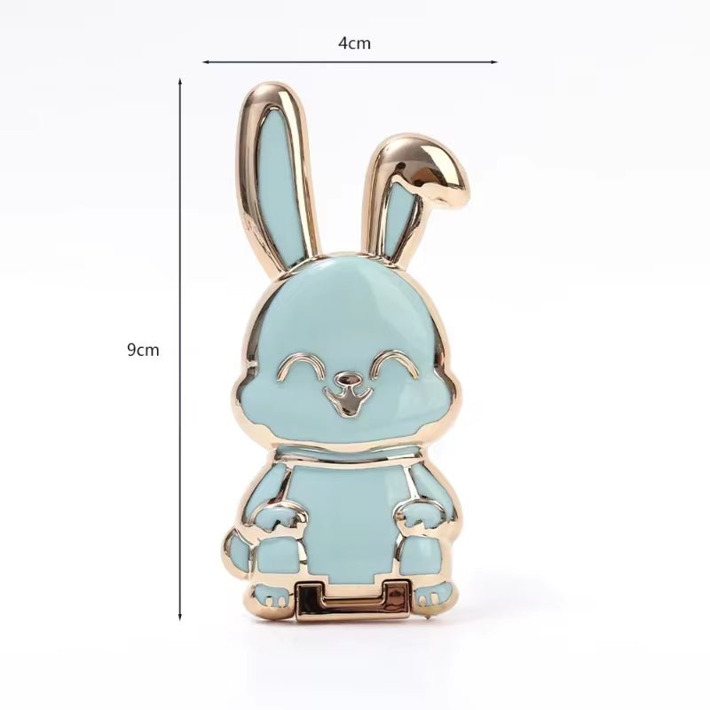 The finger ring phone holder is a compact and lightweight desktop accessory that features a cartoon rabbit design. - Dymand