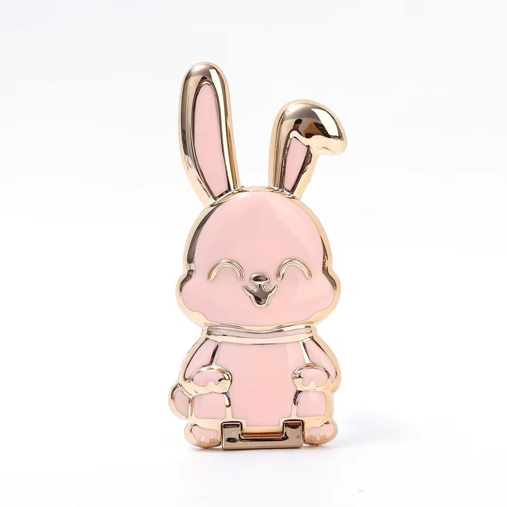 The finger ring phone holder is a compact and lightweight desktop accessory that features a cartoon rabbit design. - Dymand
