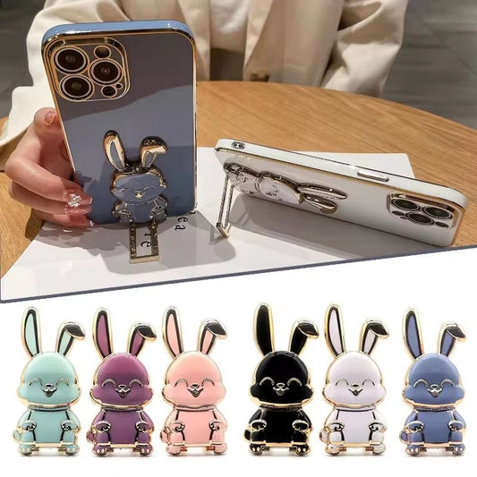 The finger ring phone holder is a compact and lightweight desktop accessory that features a cartoon rabbit design. - Dymand