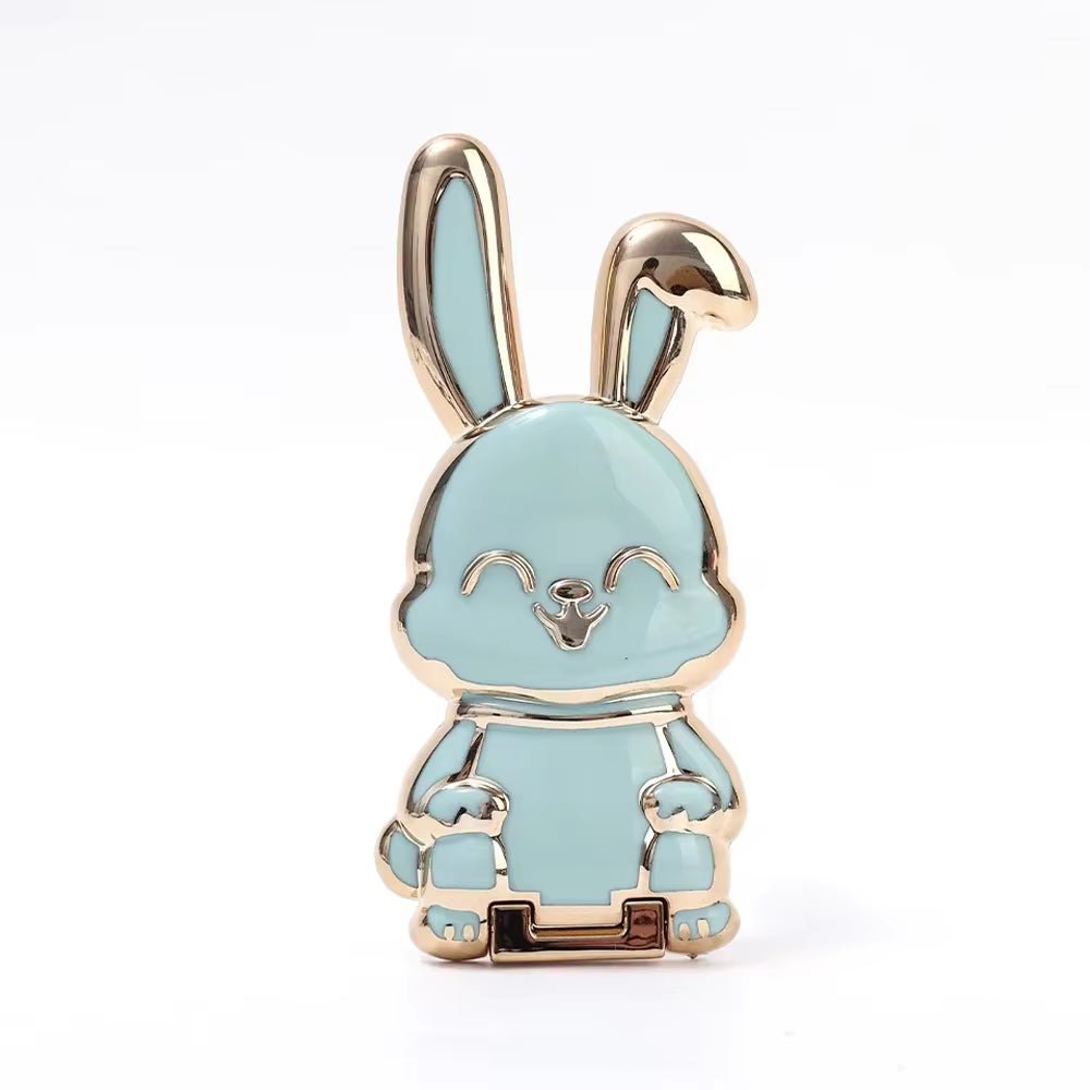 The finger ring phone holder is a compact and lightweight desktop accessory that features a cartoon rabbit design. - Dymand