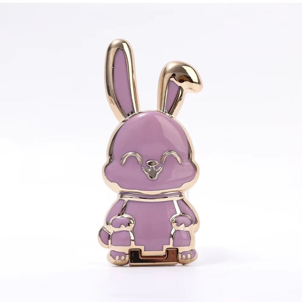 The finger ring phone holder is a compact and lightweight desktop accessory that features a cartoon rabbit design. - Dymand